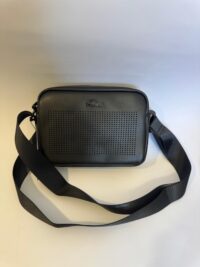 Black Lacoste bag with perforated design and strap.