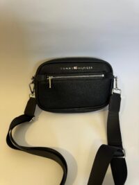 Black Tommy Hilfiger bag with elegant design and functional strap.