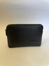 Bottega Veneta black clutch, elegant woven leather design.