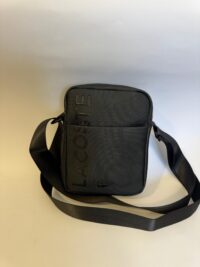 Black Lacoste men's crossbody bag with logo and adjustable strap.