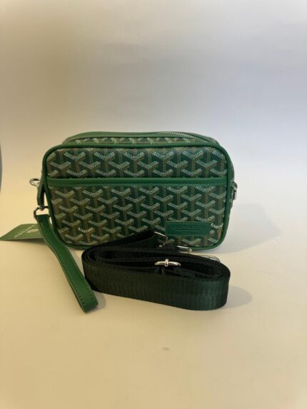 Green Goyard crossbody bag with adjustable strap and signature pattern.