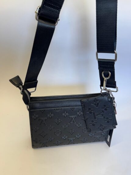 Black Louis Vuitton bag with cardholder and strap.