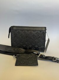 Black Louis Vuitton bag with card holder and strap.